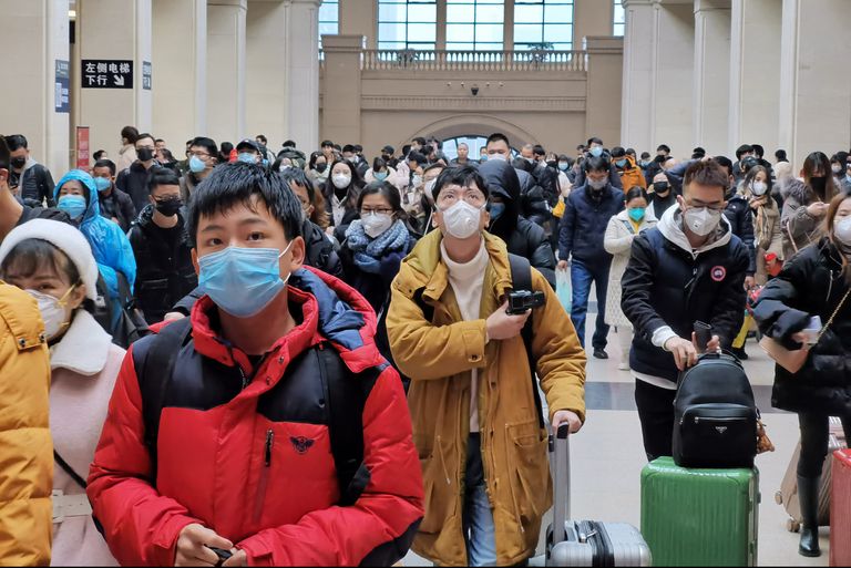 people wear face masks as they wait at hankou railway news photo 1580144291